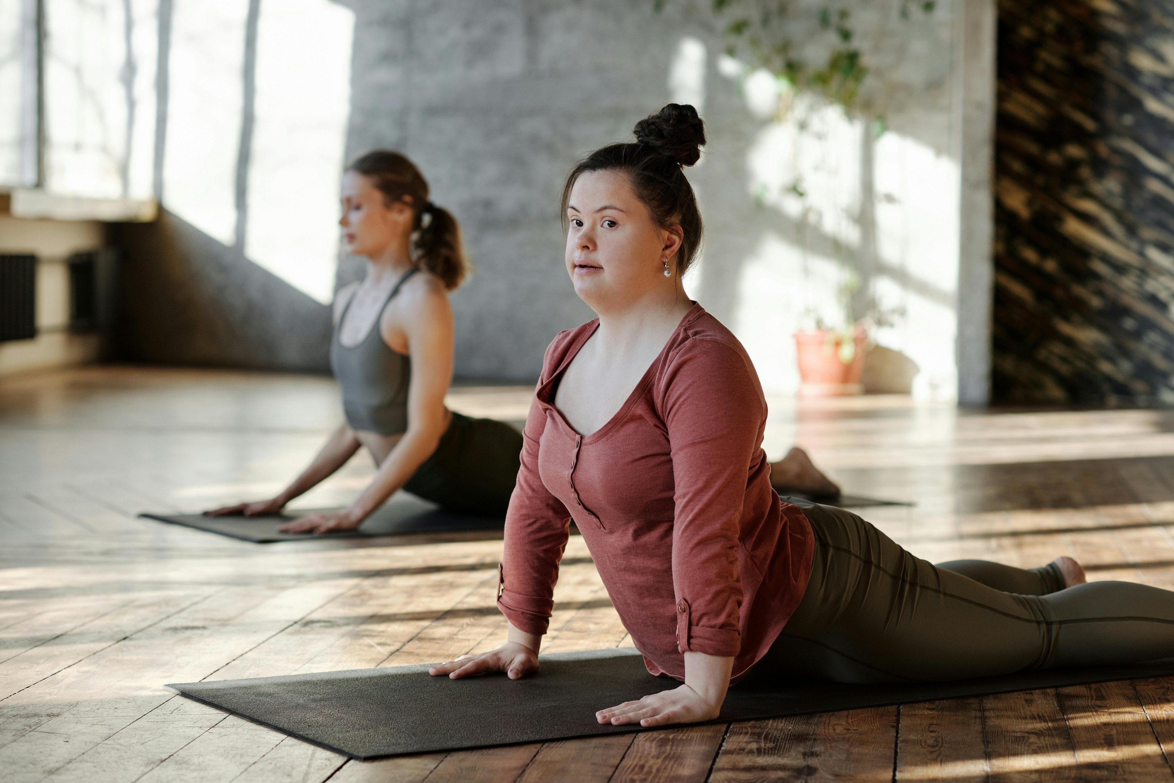 Girl with Down syndrome doing yoga