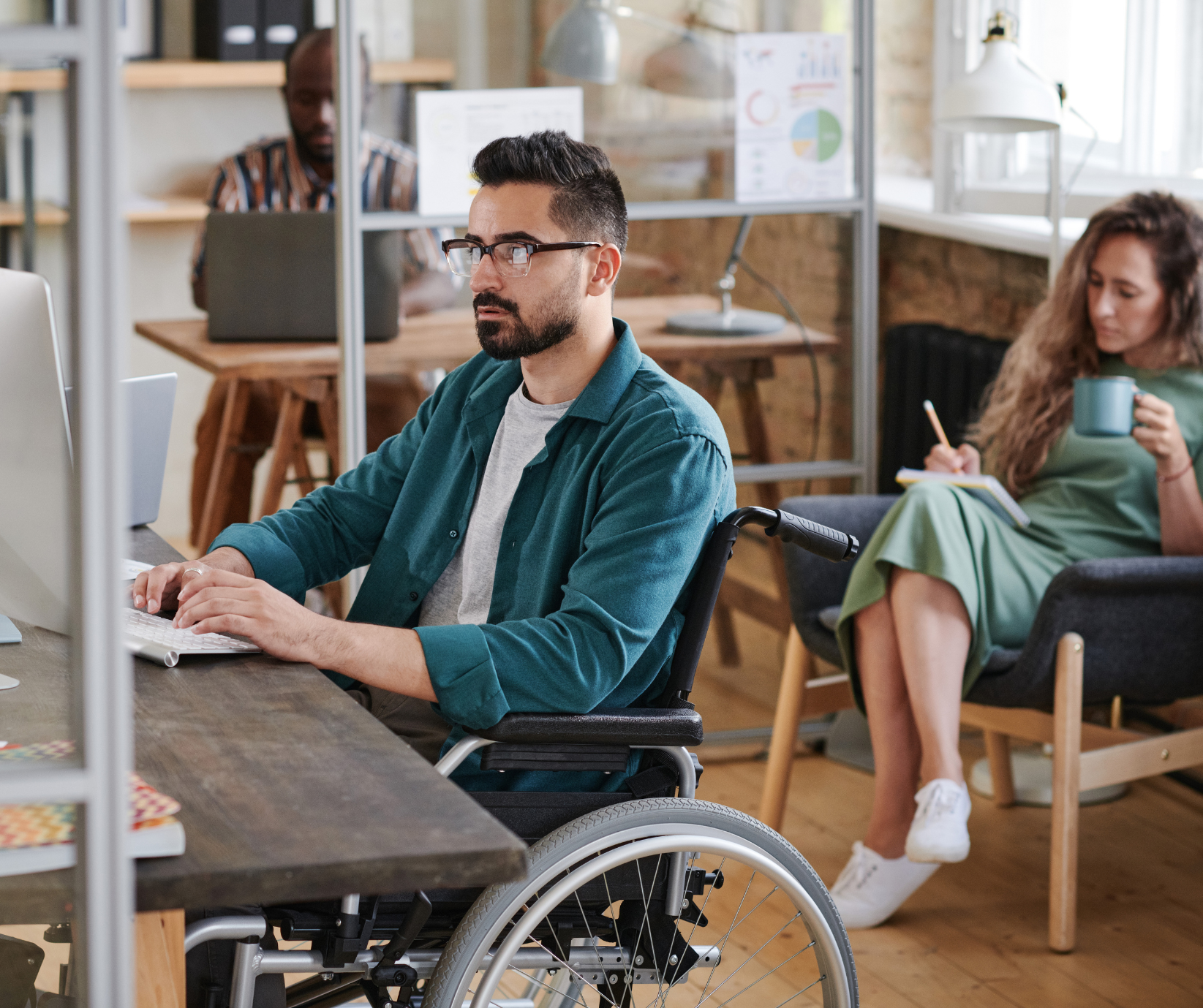 wheelchair user man working in an office